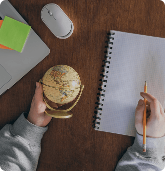 Notebook and globe ready for study-abroad planning