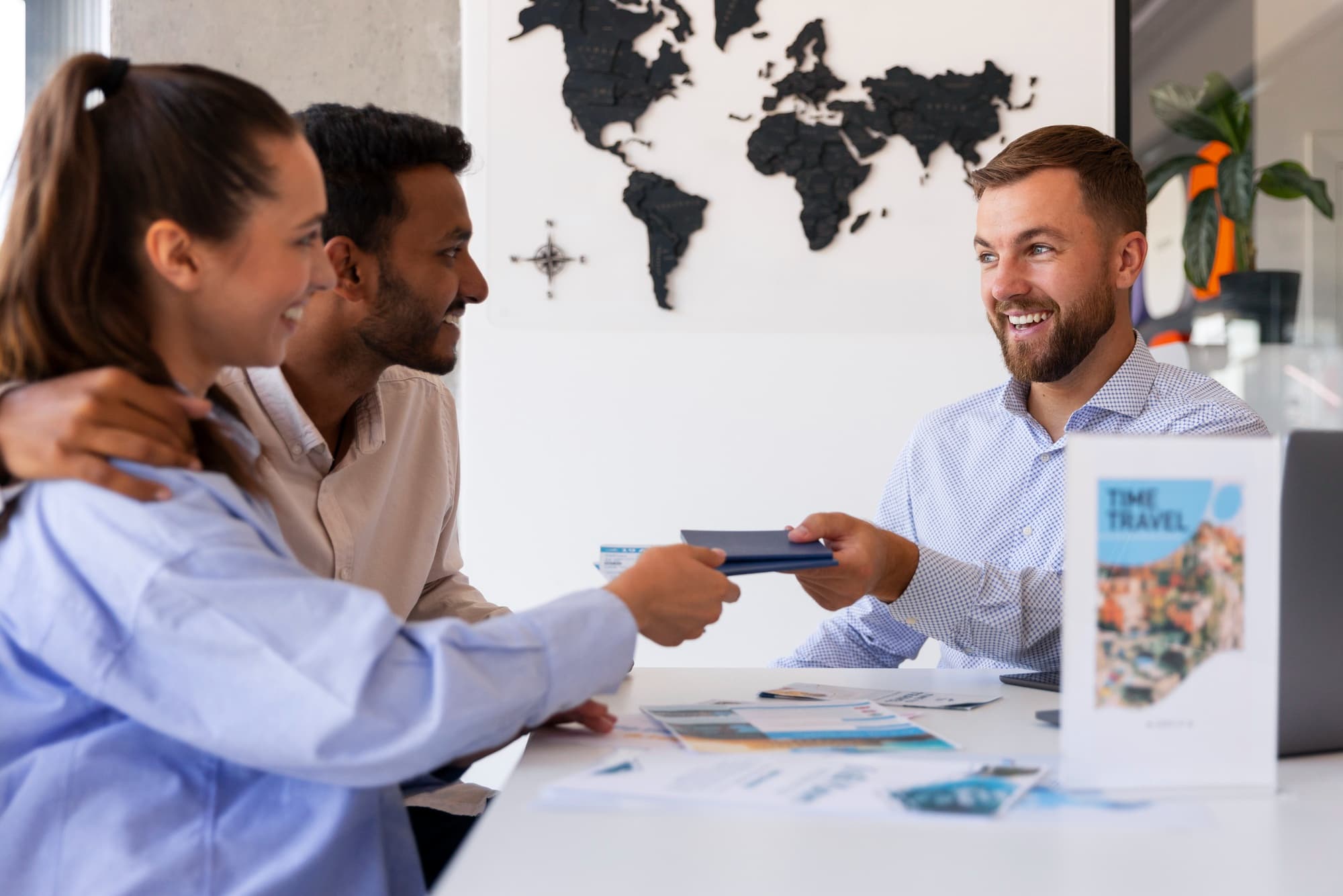 Visa consultant helping a couple with their travel documents